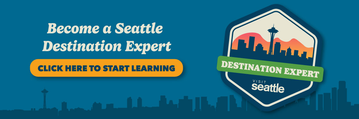 Badge with Seattle skyline silhouette and Space Needle against a sunset. Text reads: "Become a Seattle Destination Expert. Click here to start learning." The badge says "Destination Expert" and "Visit Seattle.