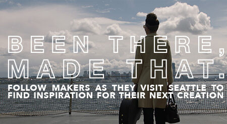 A person in a coat stands on a boat, looking at the Seattle skyline in the distance. The text reads, "Been there, made that. Follow makers as they visit Seattle to find inspiration for their next creation.