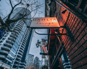 Restaurant sign lit up on a cloudy night