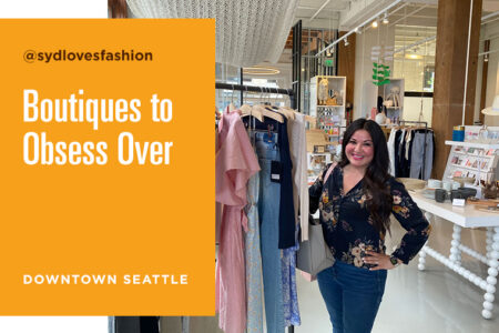 A woman stands smiling beside a clothing rack in a boutique. The text reads 