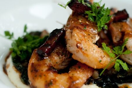 Close up food shot of shrimp & grits from Marjorie Restaurant.