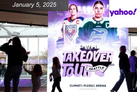 A group of people walk past a large poster at Climate Pledge Arena featuring two hockey players. The text says 