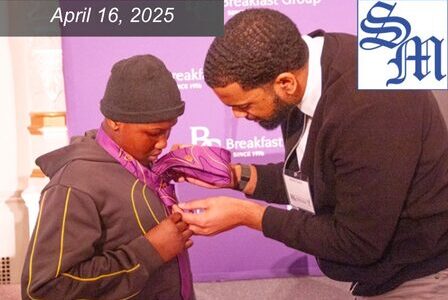 A man helps a young person put on a tie.