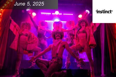 Six performers in sparkling costumes and hats pose dramatically on stage under vibrant pink and purple lights.