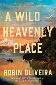 Cover of "A Wild and Heavenly Place" by Robin Oliveira. Features a lake scene with a canoe and people at sunset, surrounded by trees and mountains. Warm, glowing colors dominate the sky, with floral illustrations around the text.