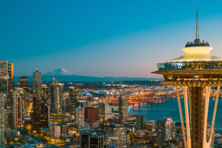 Space Needle with the city sparkling behind at dusk